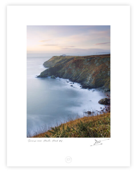 Cliffs and lighthouse at Howth Head overlooking the Irish Sea on the Dublin coast.