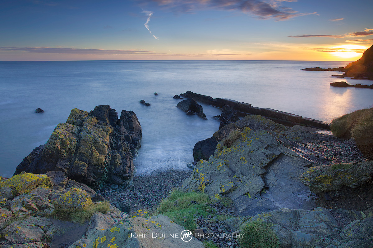 Sunrise over Naylor's Cove by John Dunne. 
