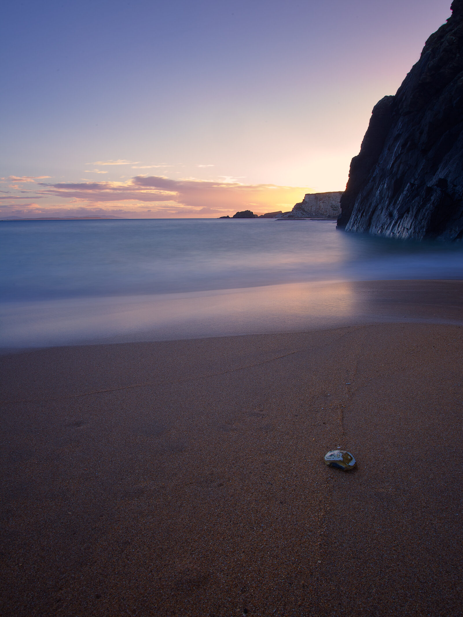 Dawn at Ballintoy Harbour by John Dunne.
