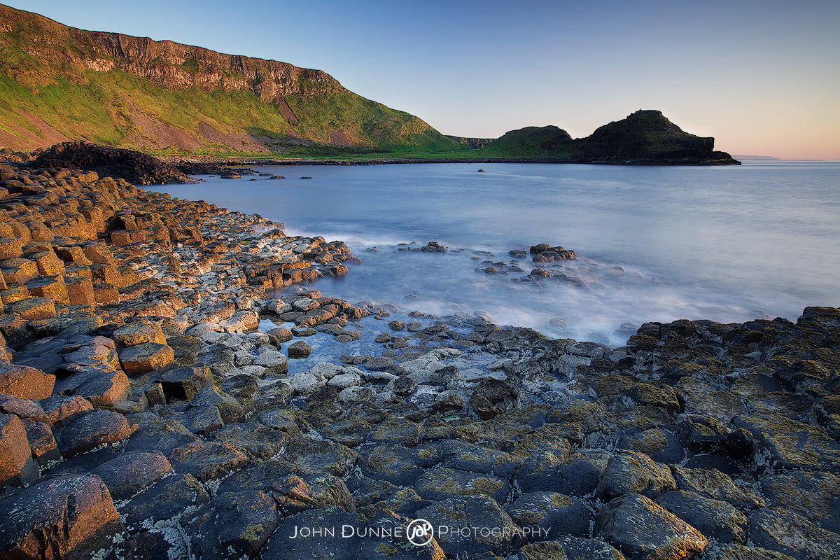 Sun sets upon the Giants Causeway by John Dunne. 