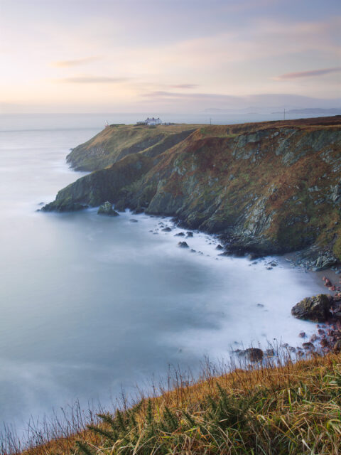 Cliffs and lighthouse at Howth Head overlooking the Irish Sea on the Dublin coast.