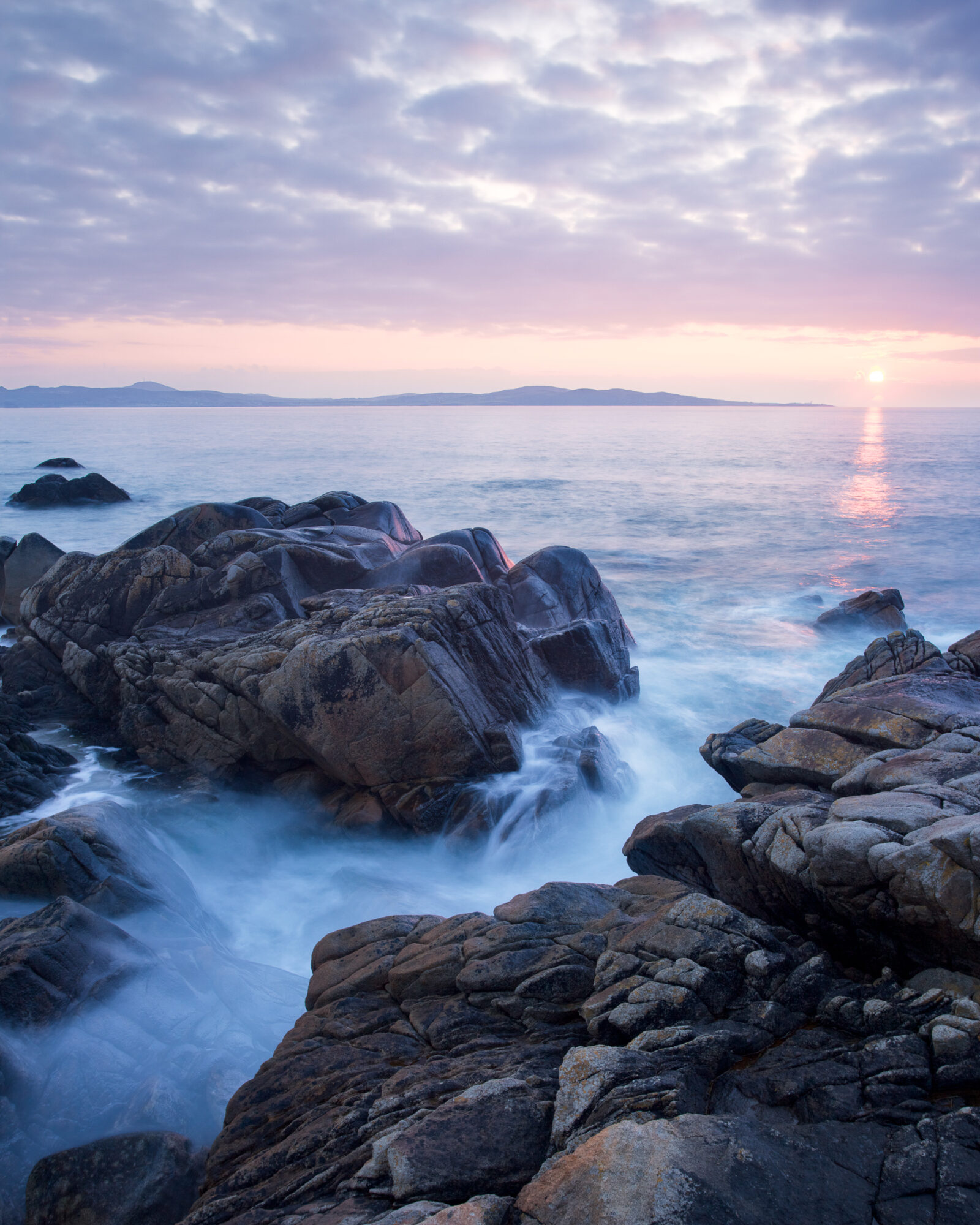 Sunset at Dunaff Bay by John Dunne. 