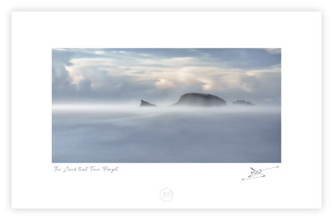 Sea mist partially obscuring Burke’s Island at Kilfarrasy Cove on the Copper Coast in County Waterford.