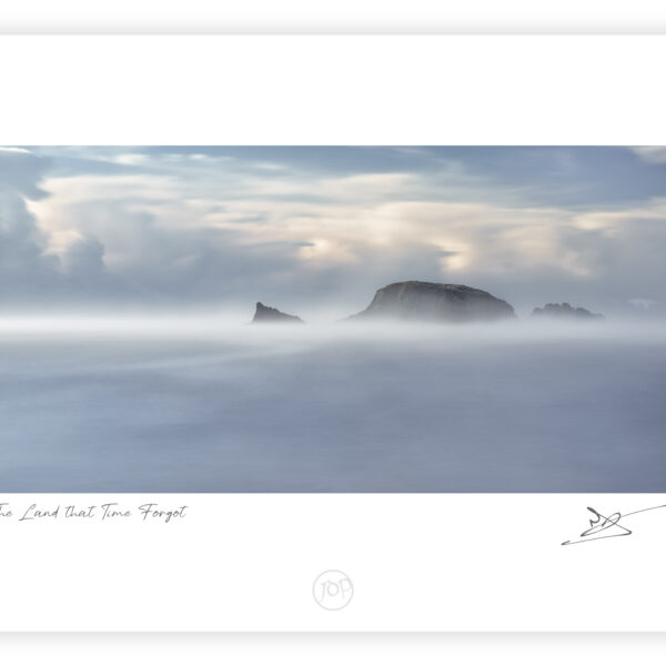 Sea mist partially obscuring Burke’s Island at Kilfarrasy Cove on the Copper Coast in County Waterford.