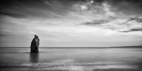 Sea stack standing offshore at Ballydowane Cove on the Copper Coast in County Waterford.