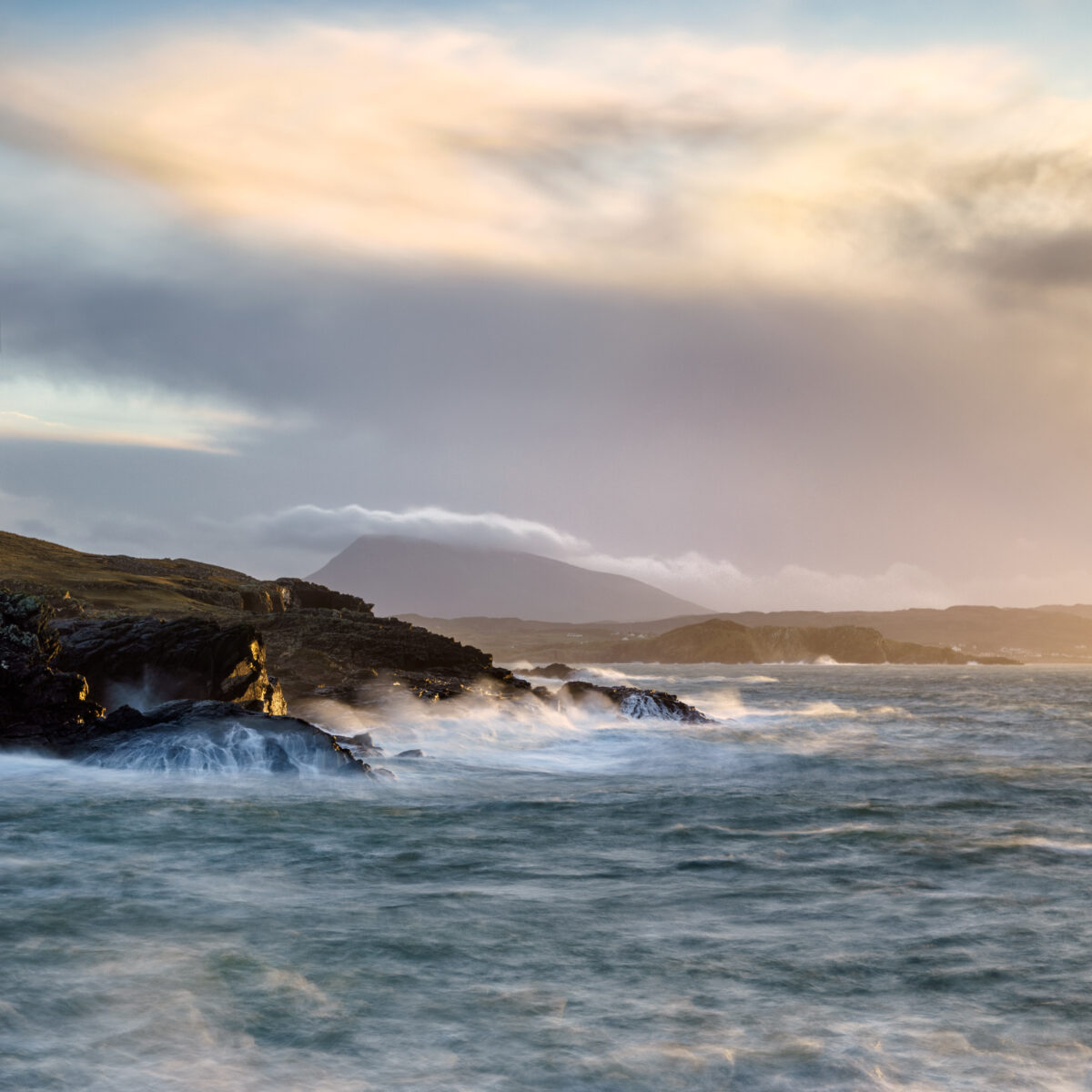 Sunset at Doagh #1 Stormy waves crashing against cliffs at Doagh on the Donegal coast under dramatic skies, Ireland, colour photograph.