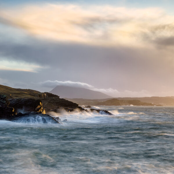 Stormy waves crashing against cliffs at Doagh on the Donegal coast under dramatic skies, Ireland, colour photograph.