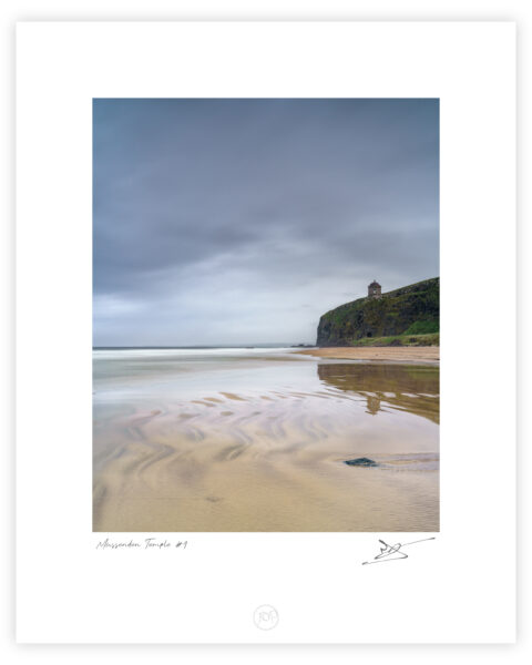 Mussenden Temple on cliffs above Downhill Strand under an overcast sky in County Derry, Northern Ireland, colour photograph.