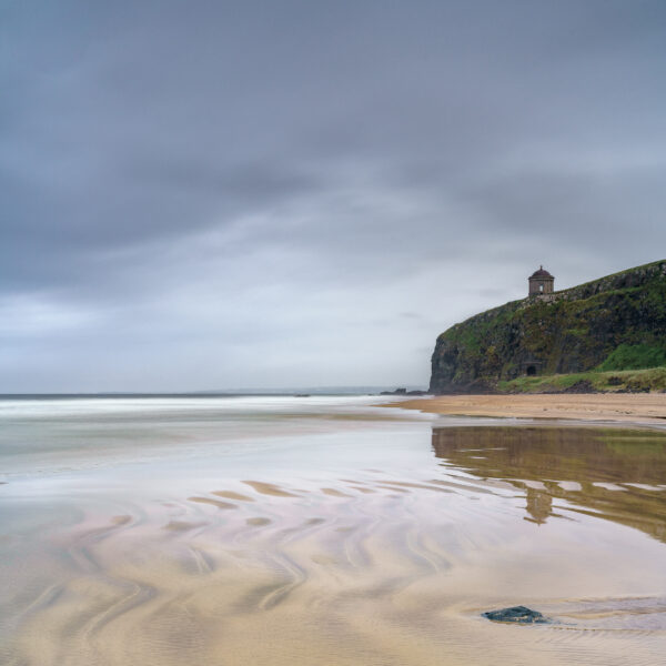 Mussenden Temple on cliffs above Downhill Strand under an overcast sky in County Derry, Northern Ireland, colour photograph.