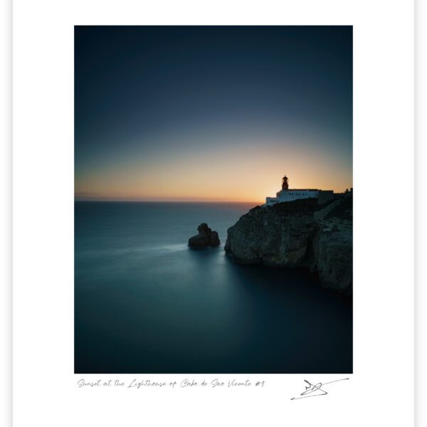 Lighthouse of Cabo de São Vicente on coastal cliffs at sunset in Sagres, Algarve, colour photograph.