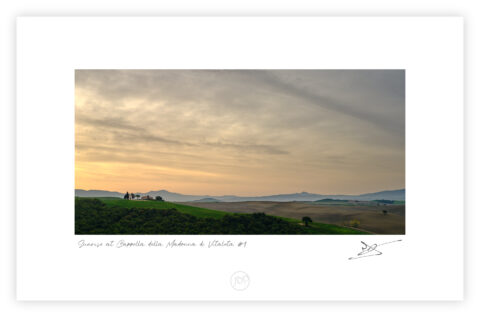 Cappella della Madonna di Vitaleta at sunrise with rolling Tuscan hills and soft clouds, Tuscany, Italy, colour photograph.