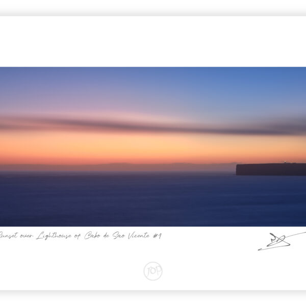 Sunset light behind Cabo de São Vicente Lighthouse in Sagres on the Algarve coast, colour photograph.