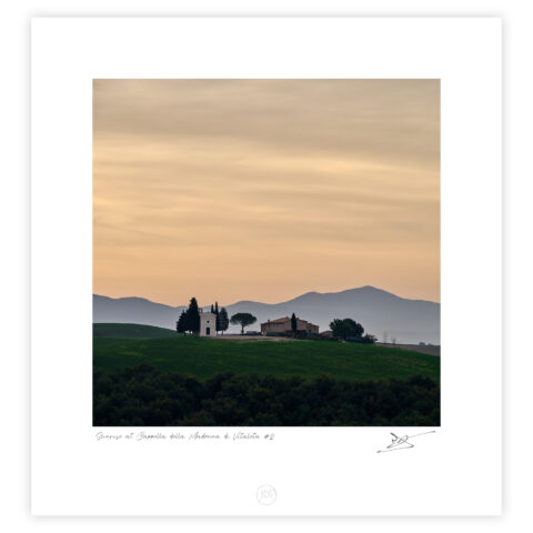 Cappella della Madonna di Vitaleta at sunrise with rolling hills in Tuscany, Italy, colour photograph.
