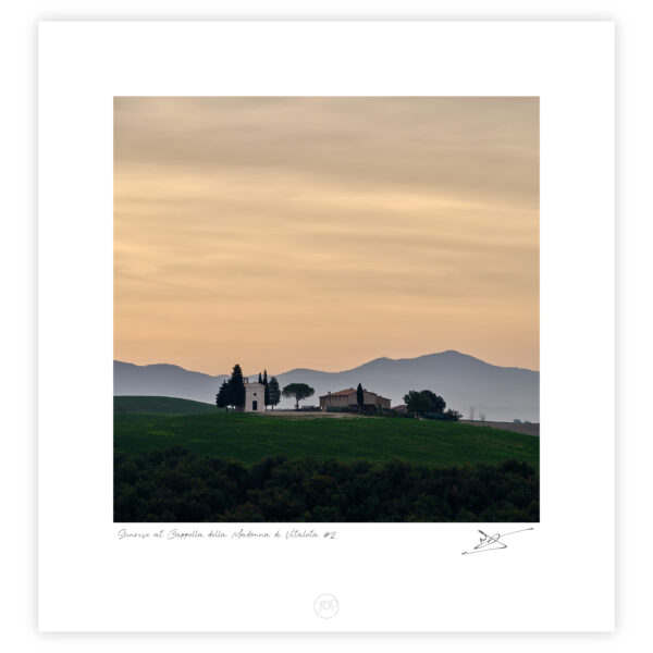 Cappella della Madonna di Vitaleta at sunrise with rolling hills in Tuscany, Italy, colour photograph.